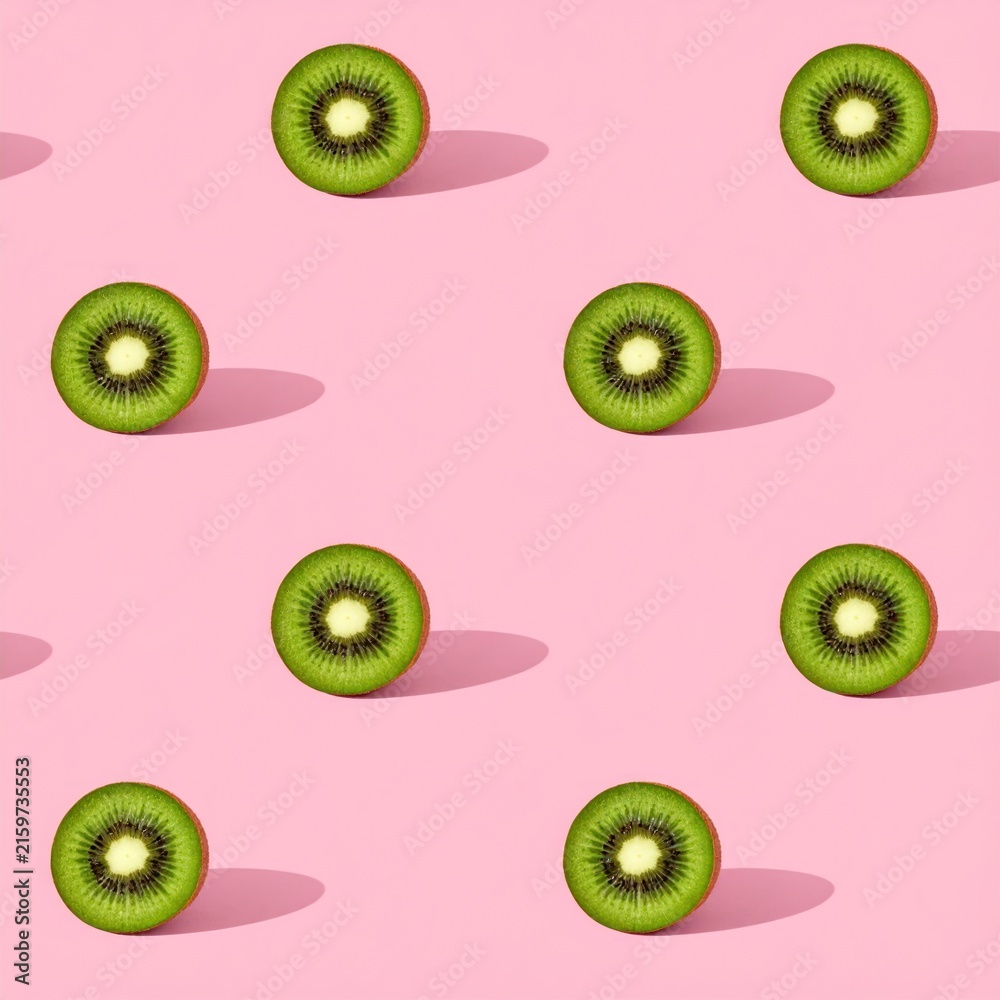 Fototapeta premium Seamless pattern of fresh kiwi slices on pink background.