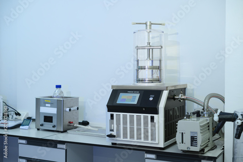 Laboratory Freeze Dryer Machine with Vacuum Pump on Lab Bench for Scientific Research and Pharmaceutical Processing