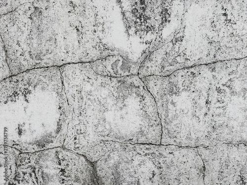 Cracked Concrete Texture: A close-up view reveals the intricate patterns of cracks and weathered texture on a concrete surface, showcasing the effects of time and natural degradation.