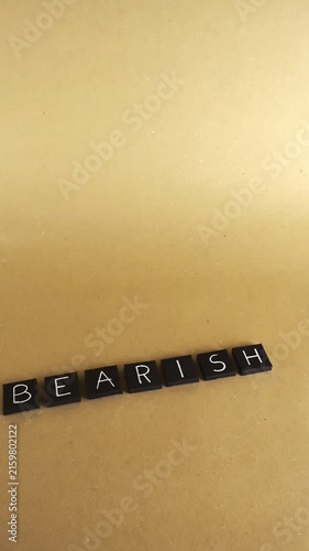 Black letter tiles spelling the word BEARISH on a light brown background, representing a financial concept of pessimism and falling stock prices in a declining market or recession