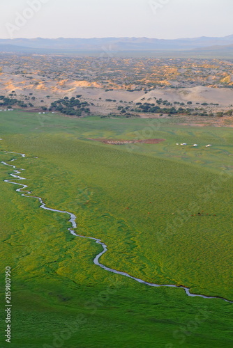 Green Steppe and Meandering Stream with Sand Dunes in the Distance, Burd, Mongolia