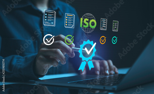 фотографія ISO quality certification with person using laptop and digital checklist to verify standards support compliance improve quality control strengthen trust and ensure reliable business processes