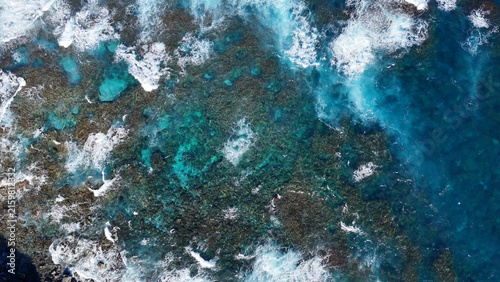Aerial View of Ocean Waves Crashing Over Rocks at Fingal Head