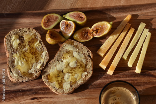 Rustic Mediterranean breakfast with figs, honey and cheese