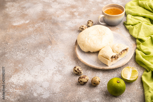 Vietnamese steamed buns Banh bao on brown concrete. side view, copy space