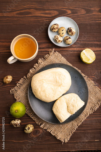 Vietnamese steamed buns Banh bao on brown wooden. top view, flat lay, close up