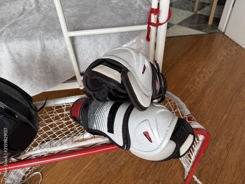 a pair of hockey gloves and a pair of hockey skates