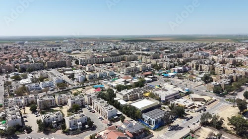 Aerial drone view of Ofakim city and industrial area in southern Israel with urban landscape and infrastructure
