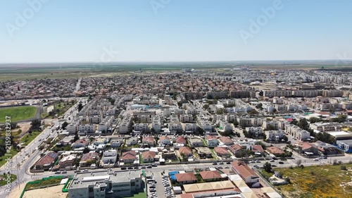 Aerial drone view of Ofakim city and industrial area in southern Israel with urban landscape and infrastructure