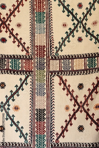 A detail of a kilim featuring traditional motifs. An example of the Turkish art of hand-weaving, showcasing geometric and floral patterns.
