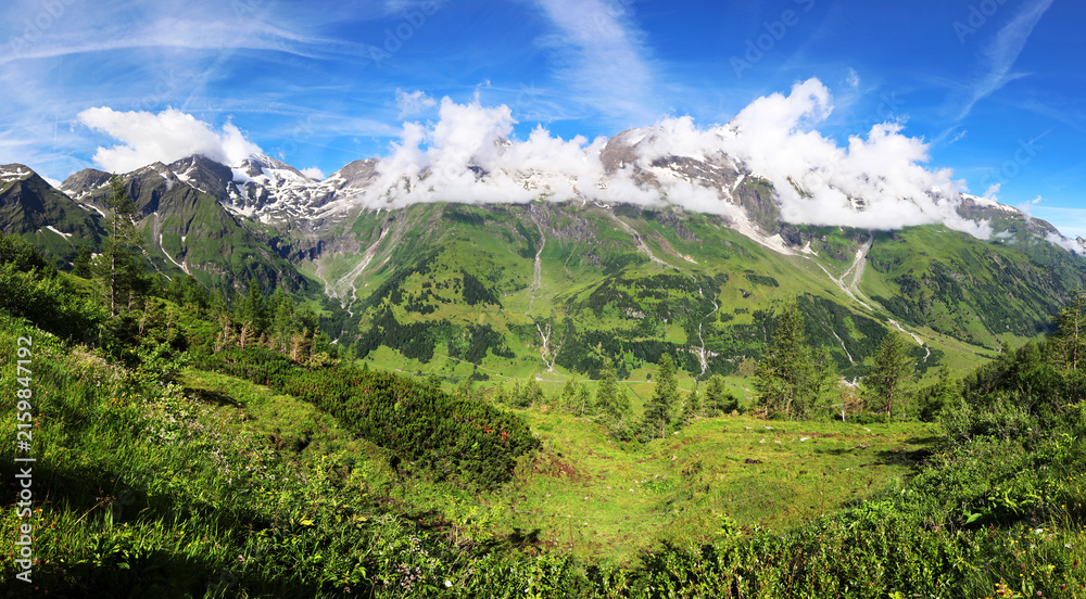 Fototapeta premium Awesome alpine highlands in sunny day. Scenic image of fairy tale Landscape with Majestic Rock Mountain on background. Austria Alps