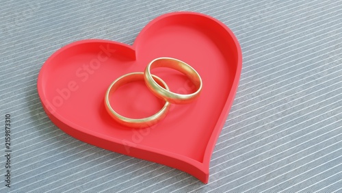 Canvastavla Two gold wedding rings and a red heart on a gray background, love and lifelong c