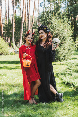 Foto Mother and daughter celebrate Halloween with spooky costumes and fun