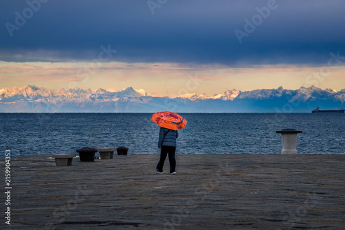 Trieste in winter. Between the sea, snow-capped mountains, and historic monuments.