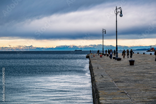 Trieste in winter. Between the sea, snow-capped mountains, and historic monuments.