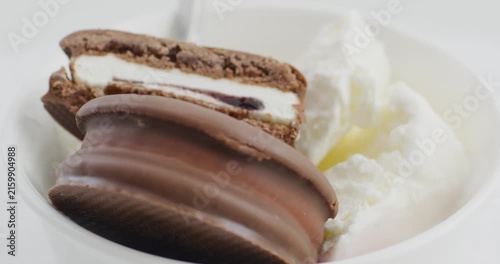 Ice cream. A bowl of ice cream and some chocolate filled cookies. A tasty breakfast. A delicious dessert. 