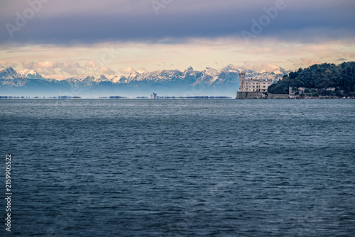 Trieste in winter. Between the sea, snow-capped mountains, and historic monuments.