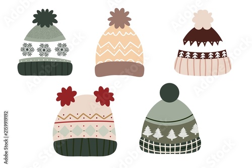 Set of knitted winter beanie hats with pompoms and seasonal patterns isolated on white background