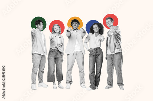 Fotografie Happy Smiling Group Of Five Young Adults, Two Males And Three Females, Engaging With Camera And Pointing, Standing Together In Studio Setting