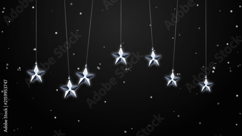 Hanging silver stars swinging gently during nighttime snowfall