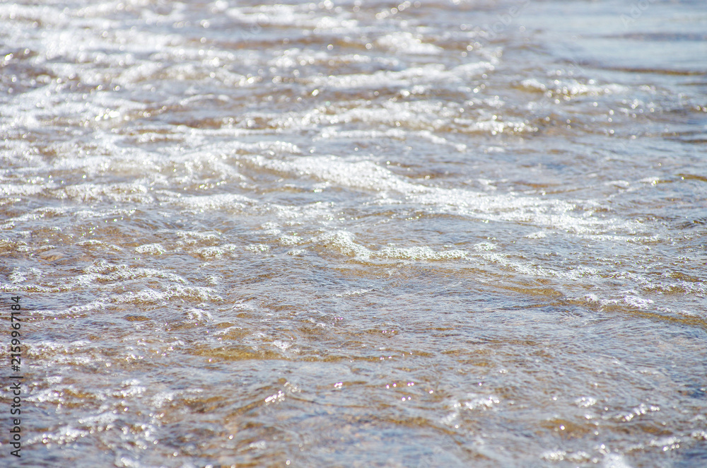Naklejka premium Soft wave of sea on sandy beach. Background.