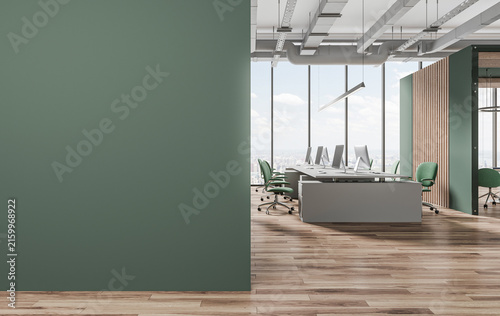 Modern office interior with empty green wall and poster mockup space, clean architectural style, wood flooring background, workplace branding concept. 3D Rendering