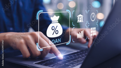 Professional hands operating laptop interface displaying financial loan application digital icons for modern banking solutions with using laptop glowing