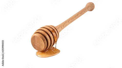 Foto Wooden honey dipper stick with dripping golden honey isolated on transparent bac
