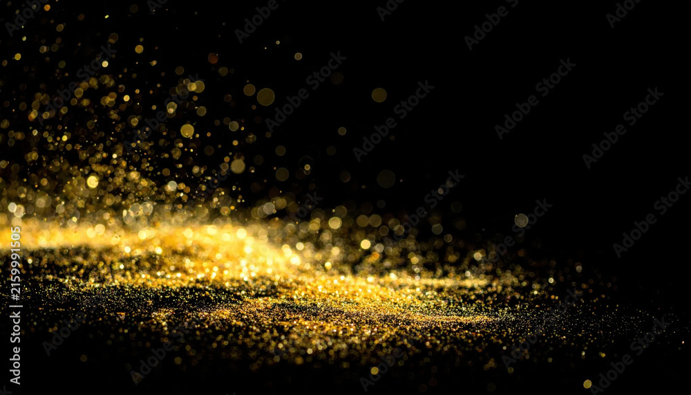 Fototapeta premium Golden glitter particle cloud on black background creating sparkling abstract celebration texture with glowing dust, bokeh, and festive atmosphere Christmas Concept