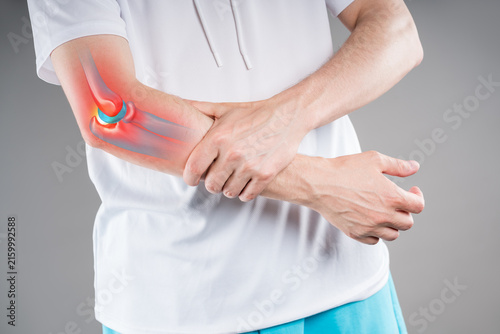 Diseases of the elbow joint, fractures displaced and inflammation of bones, close-up of person suffering from elbow pain