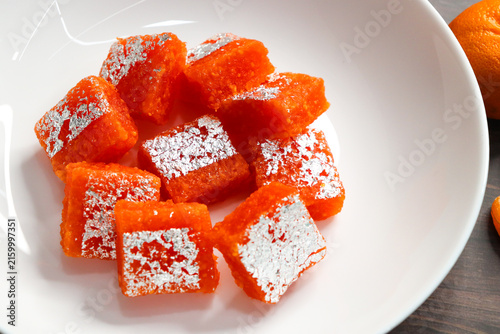 Nagpur Orange Barfi. Traditional Indian mithai made with milk solids and fresh Nagpur orange pulp. Soft, creamy fudge texture with tangy citrus flavor, inspired by India’s Orange City.