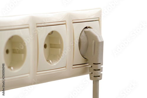 Electrical plug inserted into wall socket on transparent background. Household power strip with outlet. Energy supply, electricity connection, domestic appliance and maintenance concept.