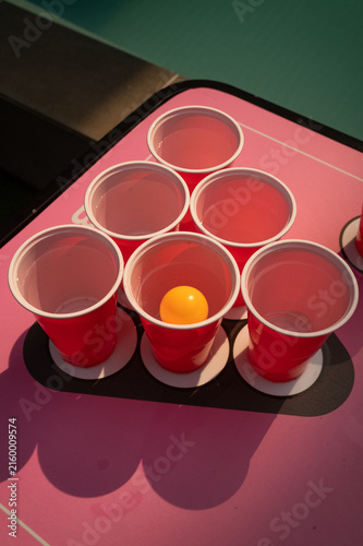 Принти на полотні Red beer pong cups with orange ping pong ball