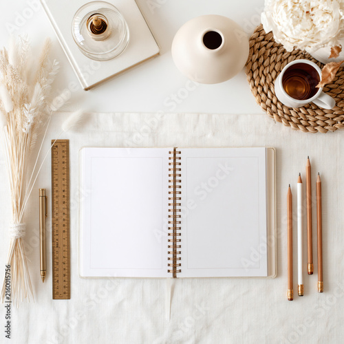 Planner notebook stationery pencil ruler pen desk mockup template beige open spiral planner with blank page white linen desk styled with pencil ruler pen vase flower cup tea pampas grass calm