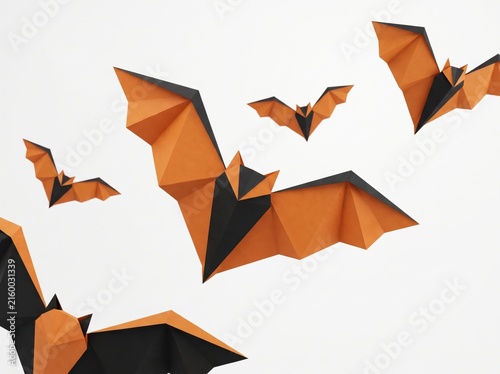 Origami paper bats flying on white background halloween craft concept