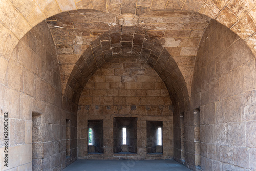 View of the historic stone vaulted interior and narrow embrasures of the Bab al-Futuh gate in El-Gamaleya, Cairo Governorate, Egypt.