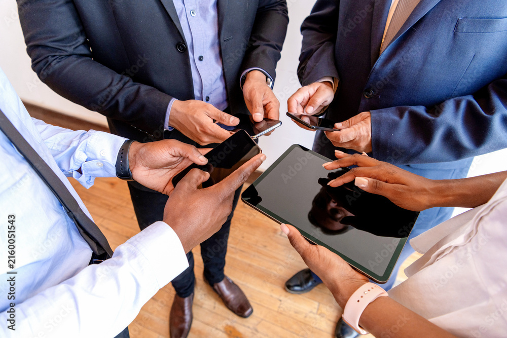 Fototapeta premium Business professionals using mobile devices.