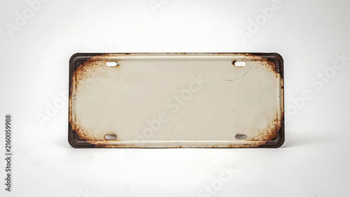 Blank rusted vintage license plate isolated on white background