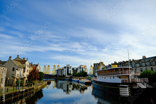 River passes through Leith, Scotland and reveals wind turbines under construction