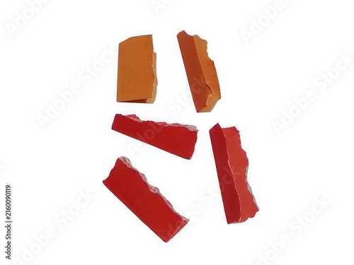 Collection of red and gold paper fragments isolated