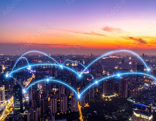 Cityscape at dusk with connected digital lines overlaid, showcasing urban infrastructure