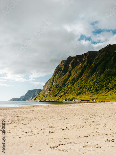 Hoddevik sandy beach in Norway landscape coastal rocks and calm sea summer season, explore scenic nature in Vestland travel offbeat Scandinavian destinations