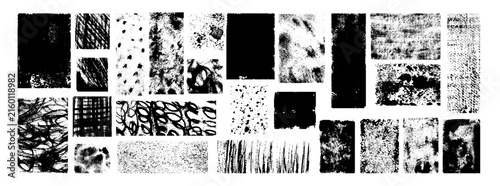 Collection of black grunge textures, distressed brush strokes, ink splatters, scratches and rough abstract marks isolated on a clean white background.