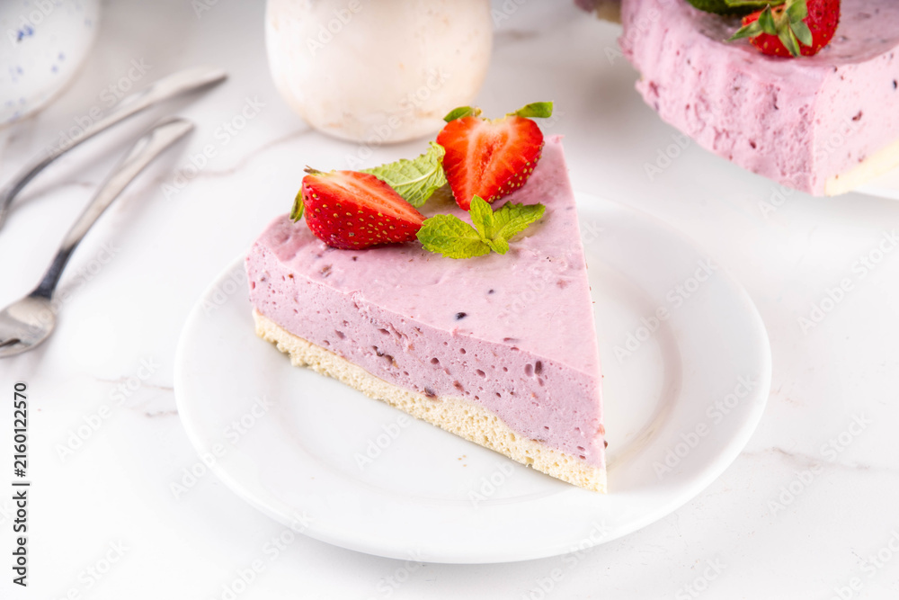 Fototapeta premium Frozen Yogurt Pie, No-Bake Berry Whipped Greek Yogurt Pie with blueberry and strawberry, Healthy diet low-calorie snack idea, copy space