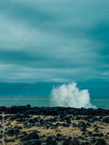Powerful ocean wave crashing on volcanic coast in Iceland

