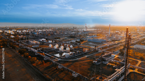 Canvastavla Petroleum refinery pipeline network in warm sunlight