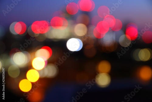 Big city night lights - defocused evening skyline of London UK. Blurry cityscape.