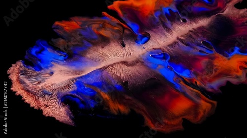 Abstract colorful fluid acrylic paint on black background