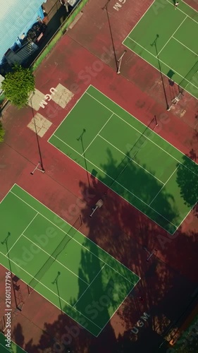 Vertical overhead drone view of outdoor tennis court complex