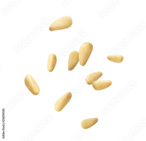 Fresh raw pine nuts flying in the air isolated. Food levitation concept.